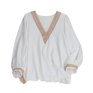 White V-neck long sleeve blouse with lace trim and vertical textured fabric