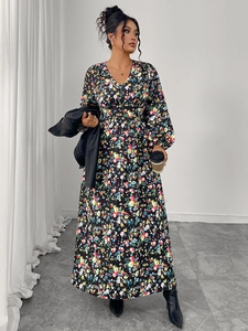 Detail of floral V-neck maxi dress with puffy long sleeves and high waist cinched design