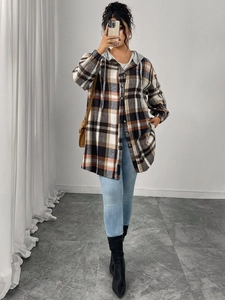 Detail of loose-fit plaid hooded shacket with buttons and grey drawstrings for women