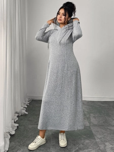 Detail view of a gray hooded long-sleeved dress with drawstring and slim fit silhouette