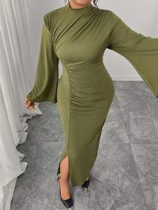 Detail of army green dress featuring elegant side ruching and a stylish leg slit