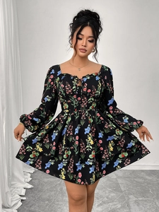 Detail view of floral tiered dress featuring a square neckline and puff sleeves