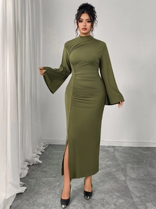 Detail of olive green dress featuring ruched sides, flare sleeves and a side slit