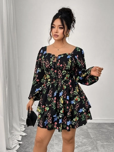 Detail view of square neck floral mini dress with lace-up chest and tiered ruffle hem