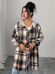 Detail of hooded plaid jacket with coffee and orange checks and thick flannel texture