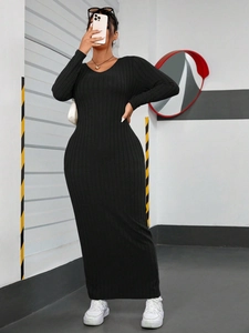 Slim fit black ribbed knit long sleeve maxi dress with minimalist crew neck design