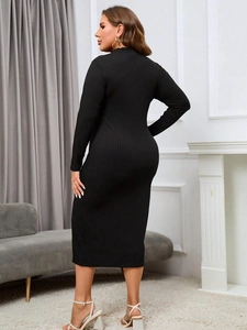 Elegant black long sleeve ribbed knit midi dress with a slim fit and side slit