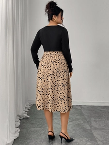 Detail of elegant leopard print skirt and black long-sleeve bodice back view