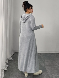 Back view of a long grey hooded maxi dress showing the loose fit and soft fabric texture