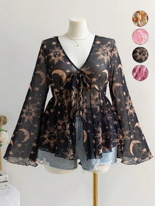 Detail of V-neck mesh blouse with celestial prints and flared sleeves on a mannequin