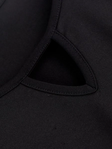 Detail of black dress featuring triangle cutout and high-density double stitching