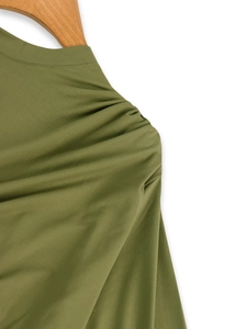Detail view of olive green ruched dress fabric and pleated shoulder craftsmanship