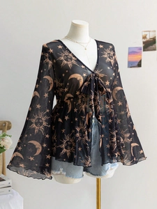 Detail of V-neck mesh top with vintage celestial prints and elegant flare sleeves