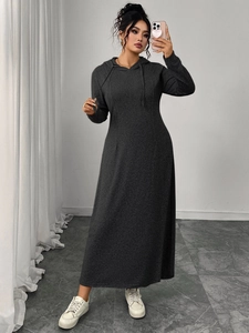 Detail of grey hooded maxi dress showing textured knit fabric and drawstring design
