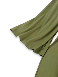 Detail of olive green dress showing ruffled bell sleeve texture and soft knitted fabric