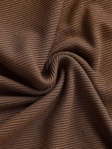 Macro detail of dark brown ribbed knit fabric texture with vertical striped pattern
