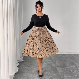 Women's leopard print dress with cutout heart neckline and elegant waist tie belt