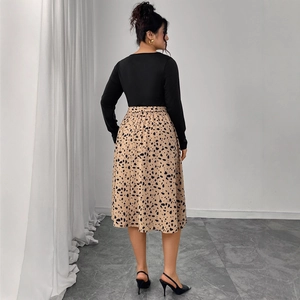 Back view of summer leopard print skirt and black long sleeve crew neck dress for women