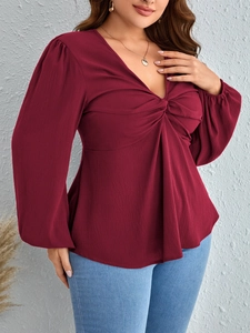 Elegant wine red V-neck long sleeve top with twist front detail and lantern sleeves