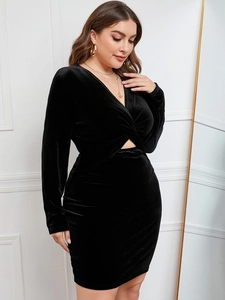 Elegant black velvet long sleeve midi dress with deep V-neck and waist cutout detail