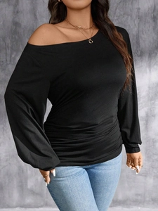 Elegant black long sleeve off-shoulder top with lantern sleeves and side ruching