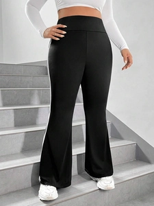 Women high waist black flared trousers with white side stripes and elastic fabric