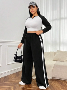 Women's two-piece lounge set with cropped long sleeve top and wide leg striped pants