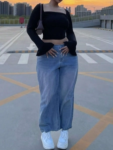 Women black long sleeve square neck crop top with light blue wide leg denim jeans