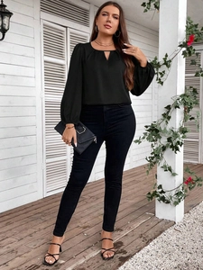 Elegant plus size black long sleeve top with V-neck cutout and stylish puff sleeves