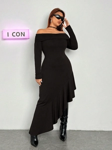 Detail of elegant black off-shoulder dress featuring ruffled trim and asymmetric hemline