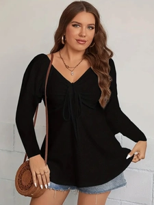 Women's black V-neck long sleeve top with pointelle texture and bow detail