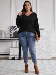 Women's plus size black V-neck long sleeve ribbed knit top in a minimalist street style