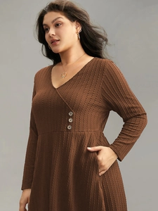 Plus size dark brown V-neck knit midi dress with long sleeves and ribbed texture