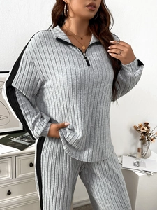 Women's two-piece ribbed knit tracksuit with half-zip collar and side stripe details