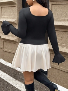 Chic black and white contrast long sleeve dress with pleated skirt and flared lace-up cuffs
