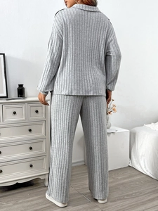 Women's minimalist grey ribbed knit two-piece lounge set with polo collar and wide trousers
