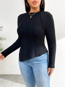 Slim fit black ribbed long sleeve top for women with asymmetrical hem and decorative seams