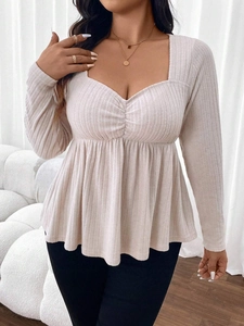 Elegant oatmeal sweetheart neckline peplum knit top with long sleeves and ribbed texture