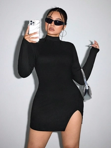 Detail of black long sleeve bodycon dress showing mock neck and side slit hem design