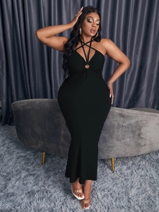 Slim fit black halter maxi dress with star-shaped strappy neckline and metal ring detail