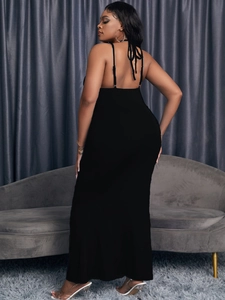 Slim fit black backless maxi dress for women featuring a halter neck and sleeveless design