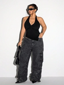 Women's black halter neck cropped top with front twist and gray cargo wide-leg jeans