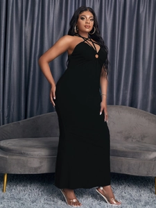 Elegant black halter maxi dress with cutout ring detail and slimming bodycon silhouette
