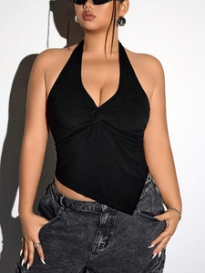 Detail view of black halter neck top with knot detail and irregular hem for women