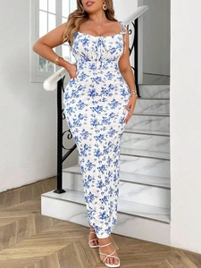 Slim fit floral maxi dress with thin straps and blue print on white background