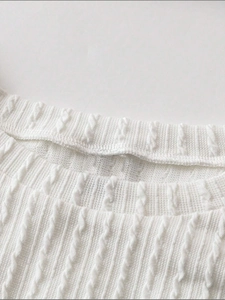 Elegant white cable-knit cropped tank top with a ribbed neckline and fringe details