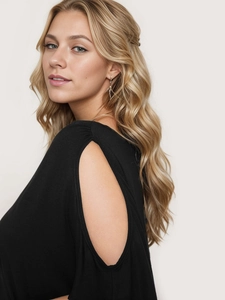 Detailed close-up of a black T-shirt featuring elegant shoulder cutouts and soft fabric