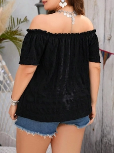 Women's off-the-shoulder black smocked crop top with ruffled edges shown from back view