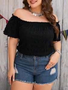 Women's off-shoulder black pleated crop top and ripped denim shorts summer outfit