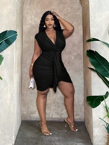 Plus size black V-neck sleeveless dress with knot detail and slimming ruched silhouette
